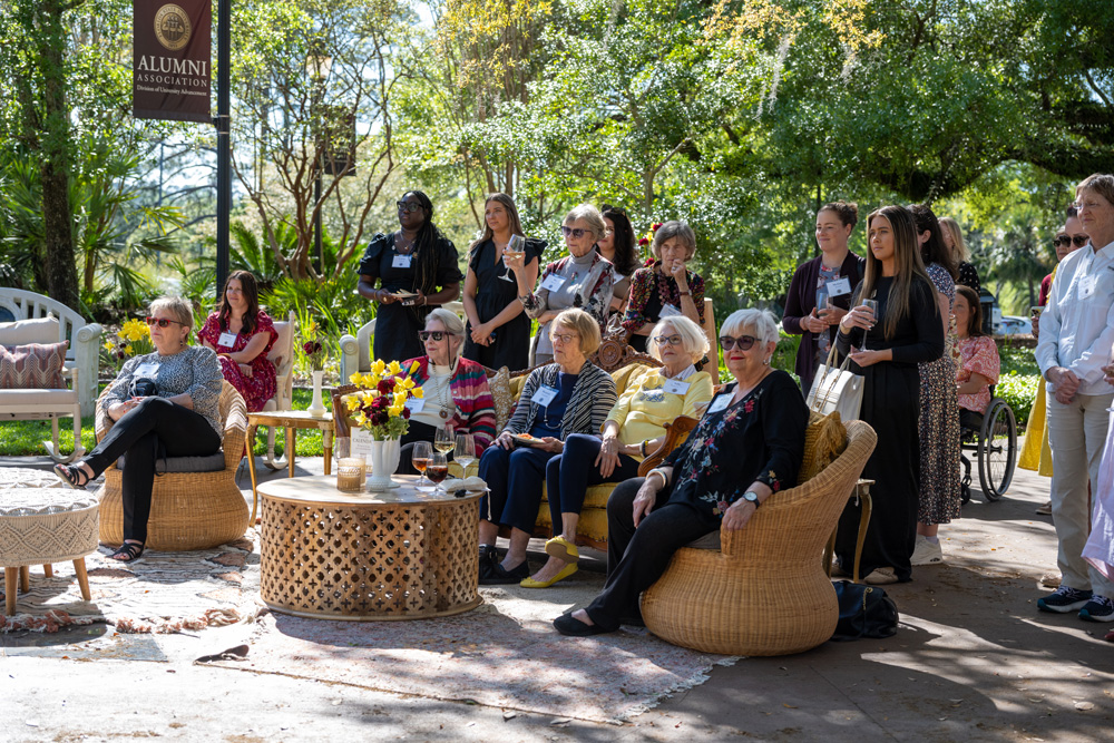 A group of women sitting outside