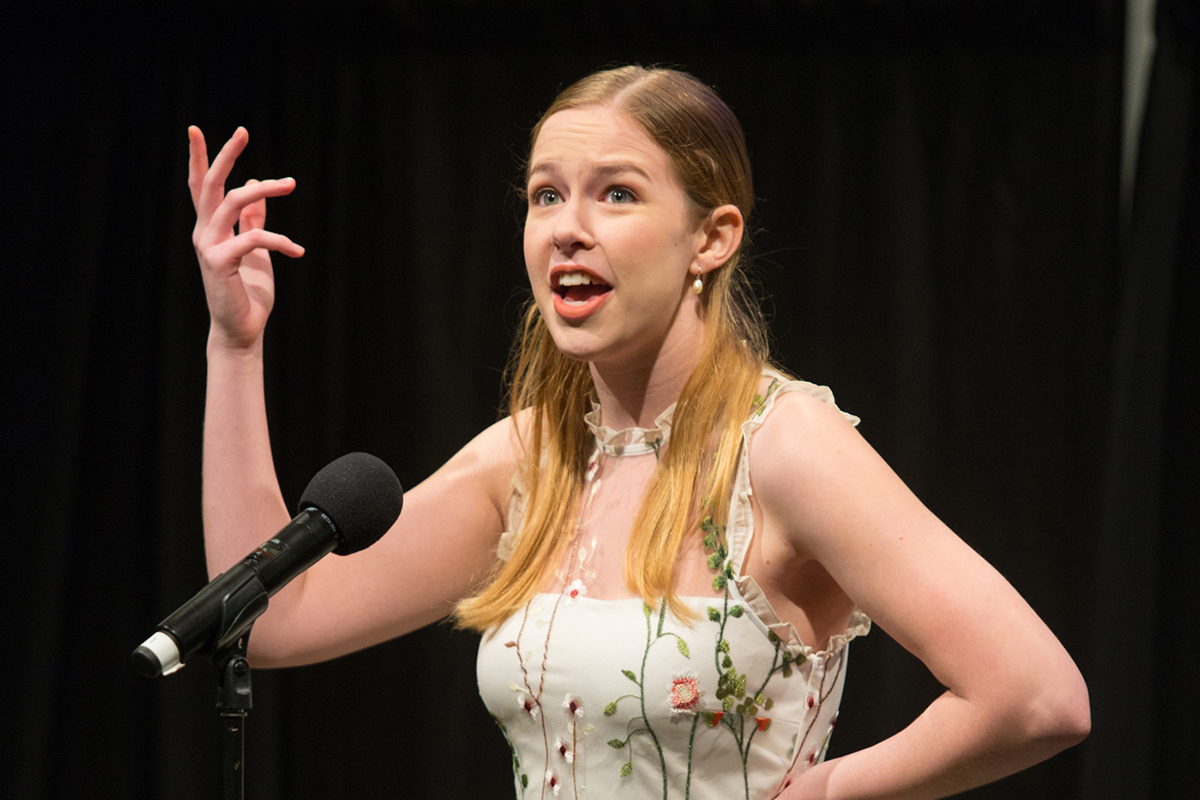 A photo of a woman singing