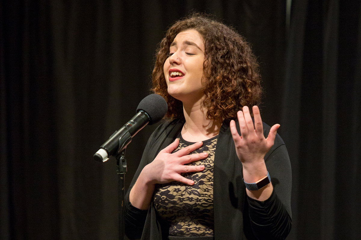 A photo of a woman singing