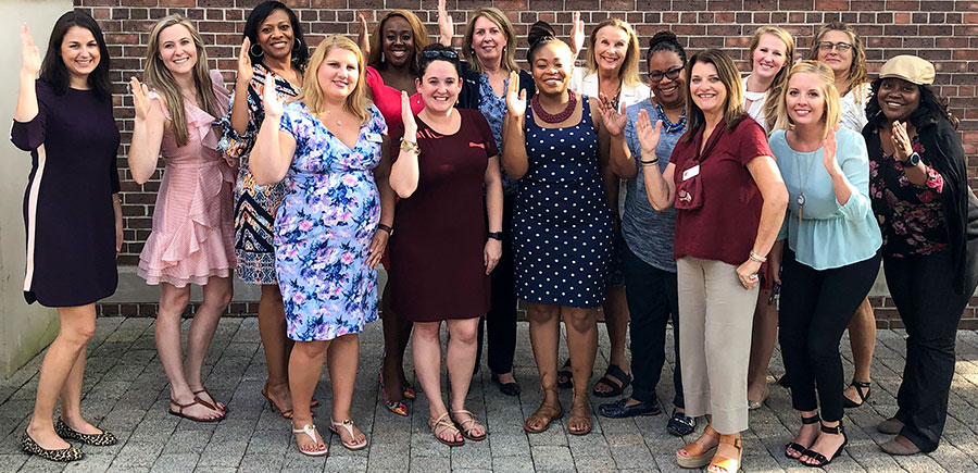 Photo featuring members of Women for Florida State University Jacksonville regional group at recent event