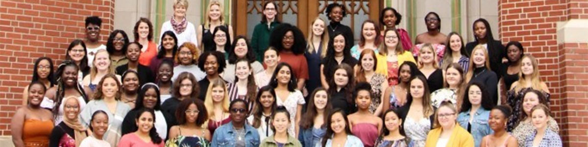 A group photo of the members of the WLI standing outside on steps