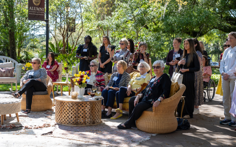 A group of women sitting outside